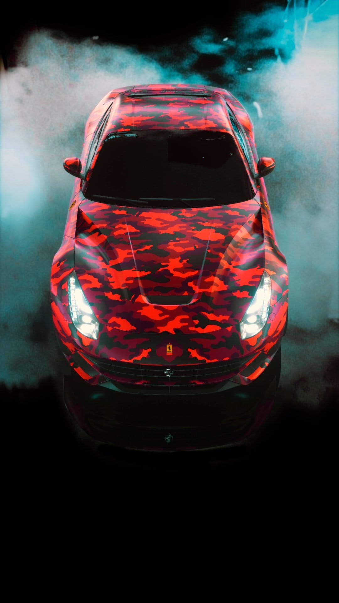 Red camouflage Ferrari seen from above surrounded by thick teal and white smoke with glowing headlights.