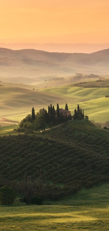 Tuscany, Italy, landscape, rolling hills, Val d'Orcia, sunrise, sunset, golden hour, farmhouse, cypress trees, idyllic, serene, scenic, travel, Italian countryside, nature, peaceful, vineyard, rural, charming, picturesque
