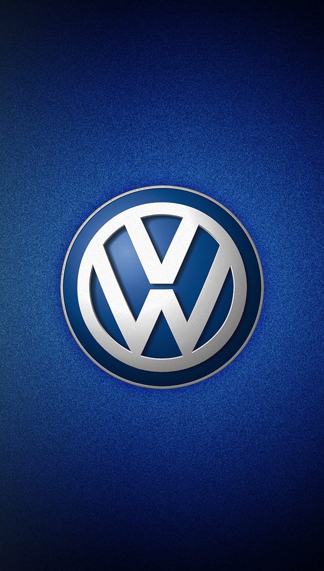 Silver Volkswagen circular emblem centered on a textured metallic blue background with subtle radial gradients.