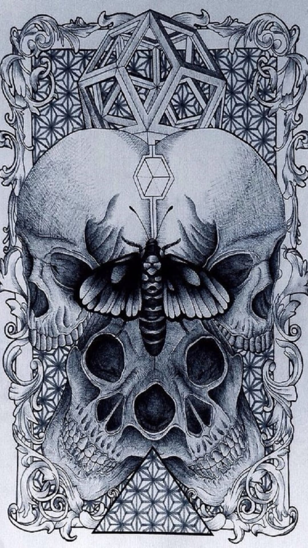 Three skulls stacked vertically with a moth on the center skull surrounded by geometric shapes and scrolls.