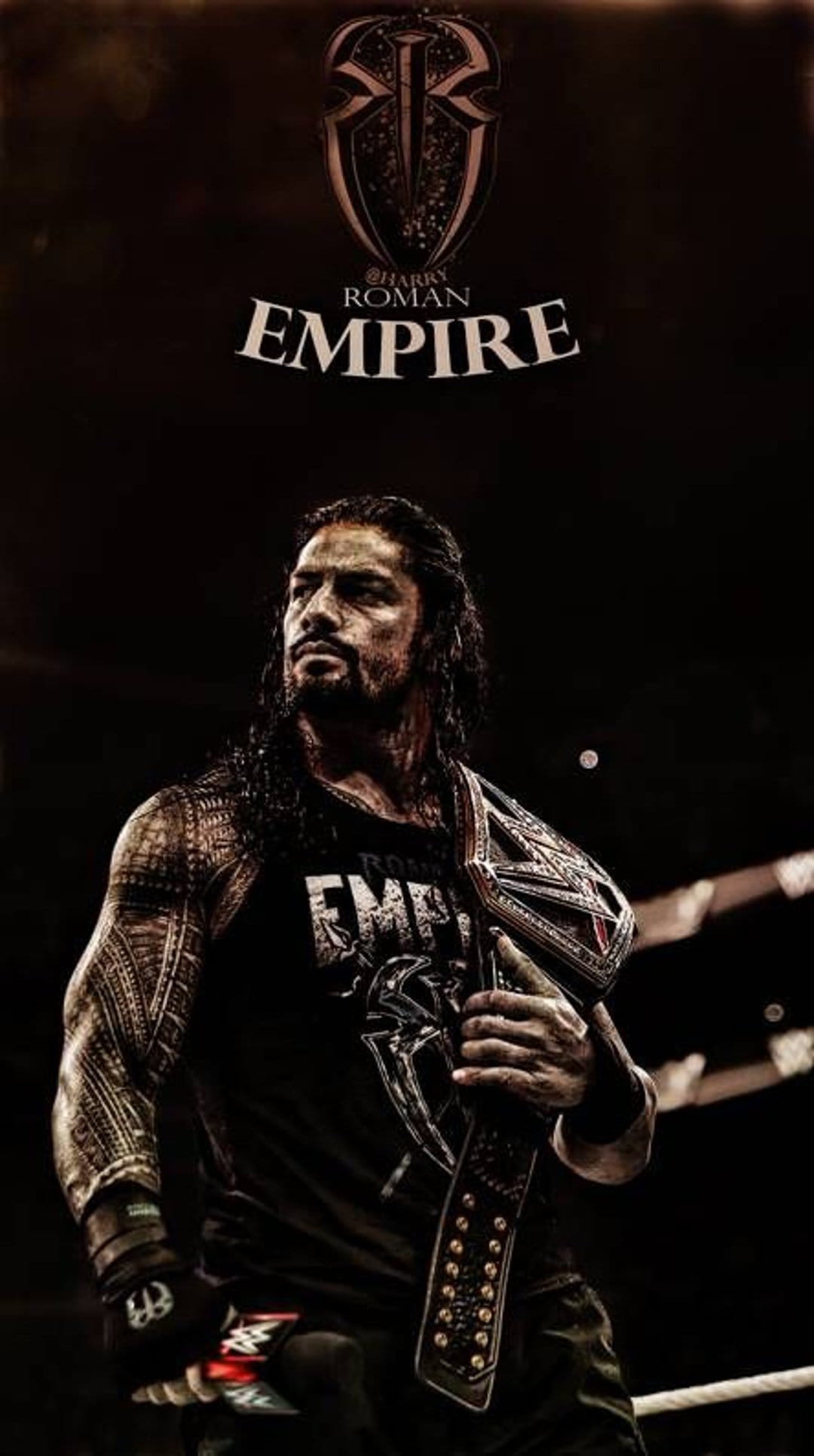 Roman Reigns holds a gold championship belt over his shoulder featuring a tribal sleeve tattoo and dark emblem.