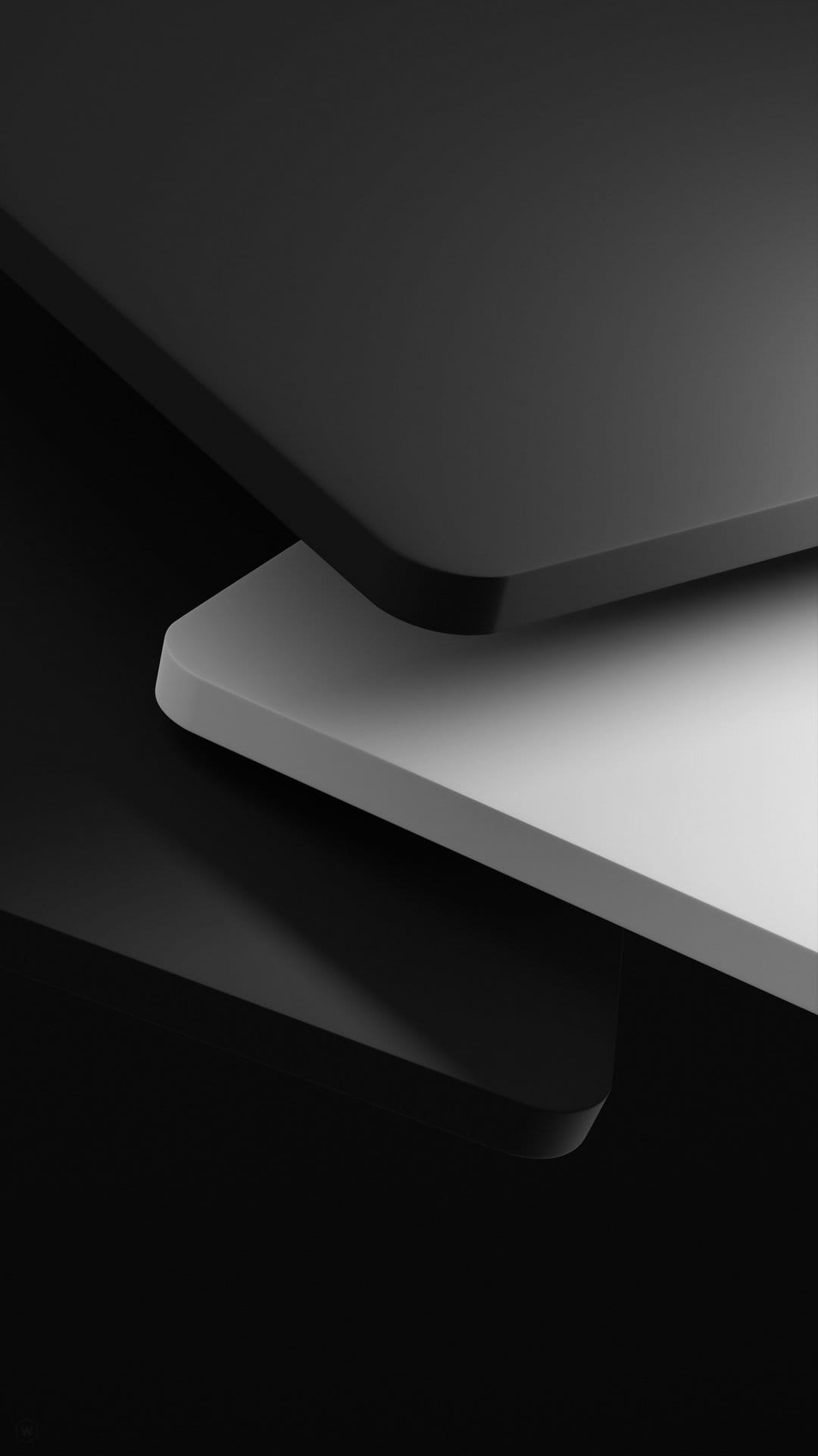 Two overlapping black and white rounded rectangles cast soft shadows against a high-contrast background.