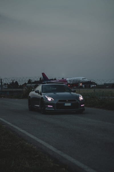 nissan r gt, nissan, car, sports car, headlight, dark, mobile wallpaper, android wallpaper, iPhone wallpaper, phone wallpaper